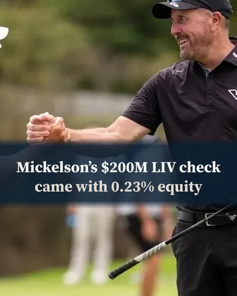 Phil Mickelson fist-bumping another LIV Golf player on the course.
